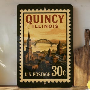 A vintage-style postage stamp from Illinois, featuring a cityscape and a bridge, is displayed on a shelf next to a wooden cutting board and a potted plant.