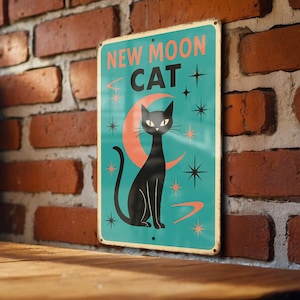 May include: A vintage-style metal sign with the words "NEW MOON CAT" in orange and white. The sign features a black cat silhouette, a crescent moon, and starburst designs on a teal background. The sign is mounted on a brick wall.
