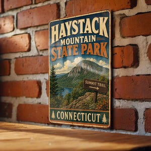 May include: A vintage-style metal sign for Haystack Mountain State Park in Connecticut. The sign features a scenic illustration of a mountain, lake, and forest, with the words "Summit Trail" and "Connecticut" prominently displayed.
