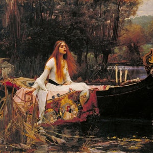 May include: A woman in a white dress sits in a boat on a river. She has long red hair and is looking to the right. The boat is decorated with a red and gold tapestry. The river is surrounded by trees and there are candles in the boat.