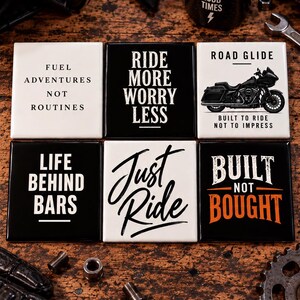 May include: A set of six square ceramic coasters featuring motorcycle-themed graphics and text including Fuel Adventures Not Routines, Ride More Worry Less, Road Glide Built To Ride Not To Impress, Life Behind Bars, Just Ride, and Built Not Bought.
