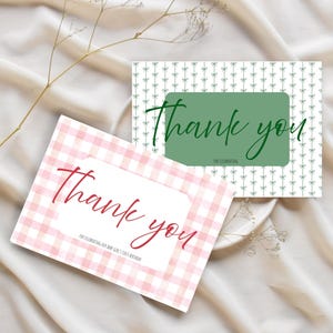 May include: Two "Thank You" cards. One card has a pink gingham pattern with red text, and the other has a green background with white bow patterns and green text. Both cards say "Thank you".