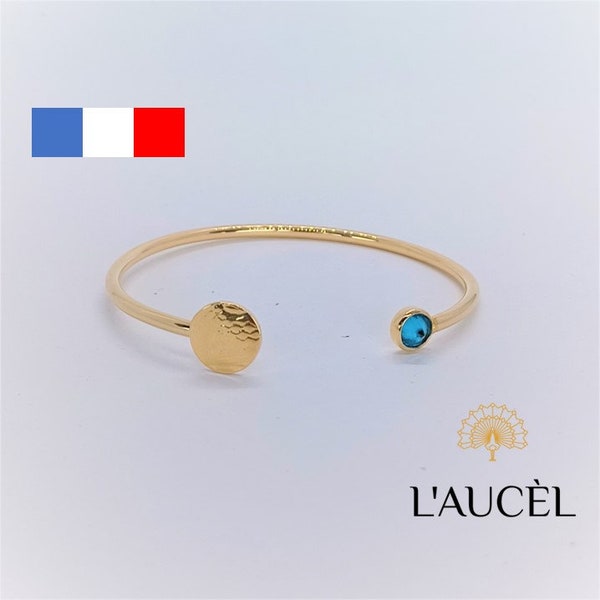 Bracelet Jonc ouvert en Plaqué Or avec Zircone bleu. Collection Plume