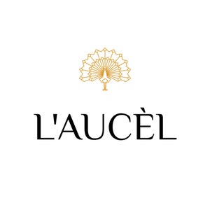 May include: A gold geometric peacock design with the text "L'AUCEL" below it.