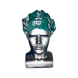 May include: Green surgical scrub hat with a white print of a stylized letter 'T'.