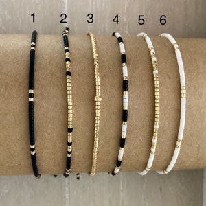 Adjustable bracelet in black, white and gold Miyuki delica beads