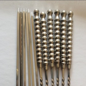 Two kebab grill poles,Brochettes de kebab