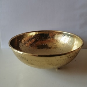 A hammered ball brass, arms, A decorative