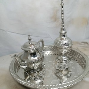 Three-piece tabletop + rose bush + teapot. Moroccan