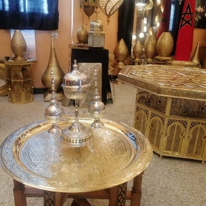 A set consisting of a traditional Moroccan incense burner and two flower water sprinklers