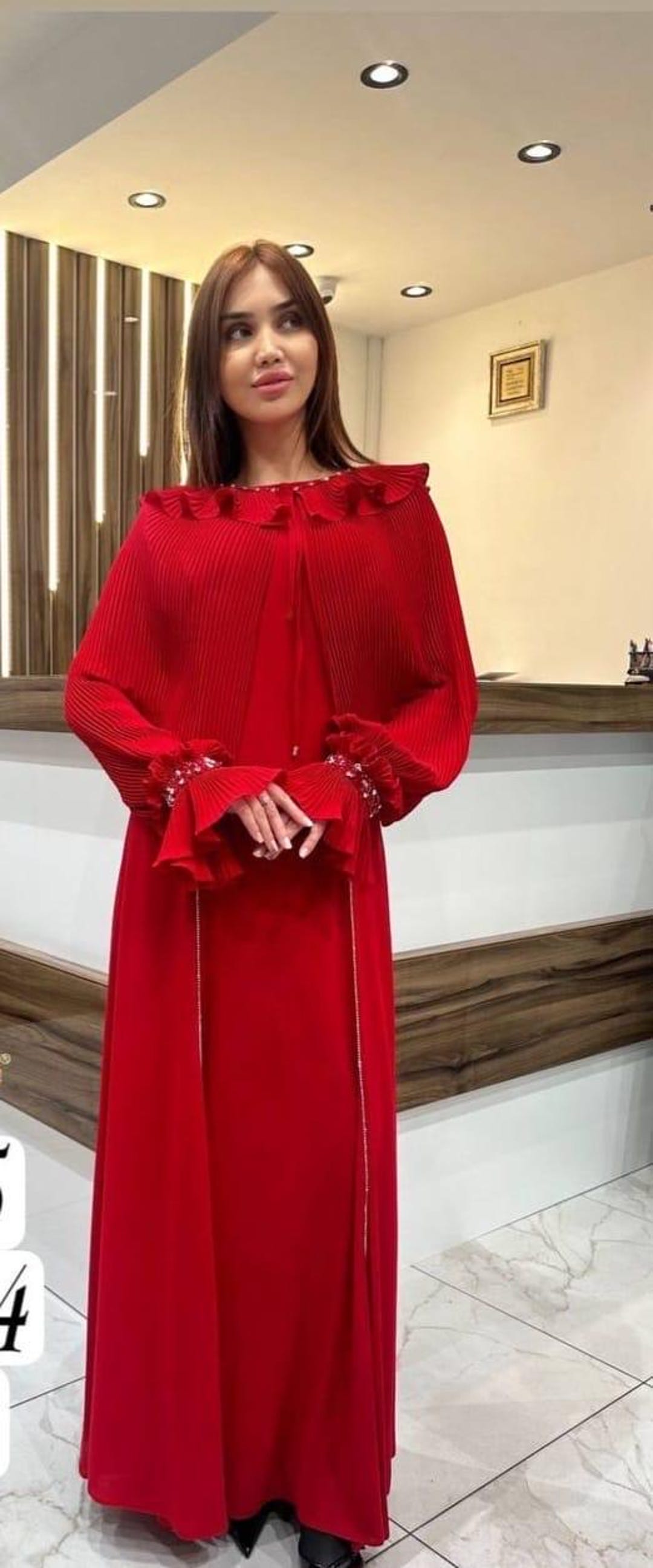 elegant modest dress The Cape Sleeve Gown in red effortlessly elegant on @suzialbarcha