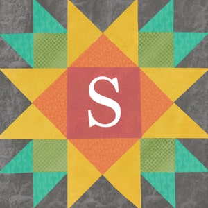May include: A yellow, orange, and green patchwork quilt block with a red center square featuring the letter "S" in white.