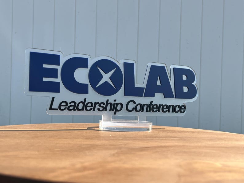 a logo for the "ECOLAB Leadership Conference".
