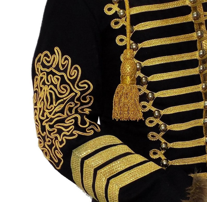 May include: A black jacket with gold trim and buttons. The jacket has a decorative gold design on the sleeve.
