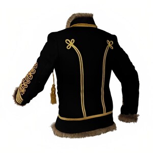 May include: Black jacket with gold trim and a fur collar. The jacket has a decorative design on the sleeves and a gold tassel.