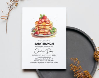 May include: A baby shower invitation with a watercolor illustration of a stack of pancakes topped with strawberries and syrup. The text reads "Please join us for a Baby Brunch honoring the mommy-to-be Christine Diaz Saturday, May 20th, 2023 The Smith Residence 314 Houston St, Nashville, TN RSVP to Monica 123.456.7890 Christine is registered at Amazon & Target"