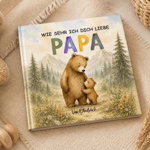 May include: A children's book with the title "WIE SEHR ICH DICH LIEBE PAPA" featuring a watercolor illustration of a bear and a cub in a forest setting. The book cover has a soft, pastel color palette.