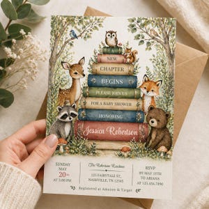 May include: A baby shower invitation with a woodland theme. The invitation features a stack of books with forest animals, including a deer, fox, bear, raccoon, owl, and squirrel. The invitation includes the text "New Chapter Begins" and "For a Baby Shower".