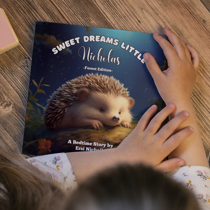 May include: A bedtime story book titled "Sweet Dreams Little Nicholas - Forest Edition -" featuring a cute illustration of a hedgehog on the cover.