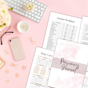 May include: A pink and white pregnancy journal with the text "Pregnancy Journal" on the cover. The journal is open to a page titled "Week 25" with a drawing of an aubergine. Other pages visible include "Gender Prediction", "My Birth Plan", and "Baby Care".