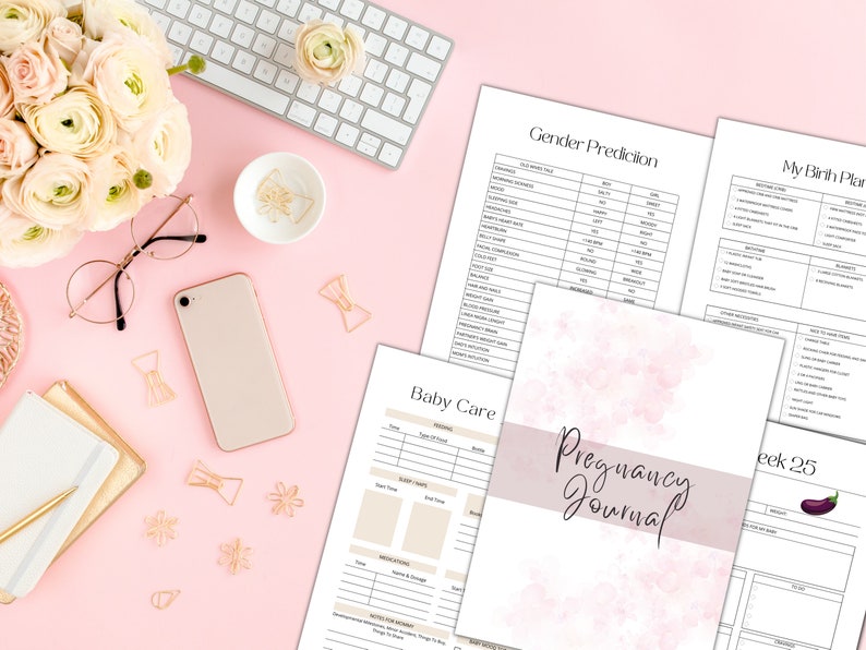 May include: A pink and white pregnancy journal with the text "Pregnancy Journal" on the cover. The journal is open to a page titled "Week 25" with a drawing of an aubergine. Other pages visible include "Gender Prediction", "My Birth Plan", and "Baby Care".