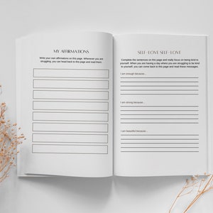 May include: An open journal with two pages visible. The left page has the title "My Affirmations" and space for writing affirmations. The right page has the title "Self-Love Self-Love" and prompts to complete sentences about self-love.