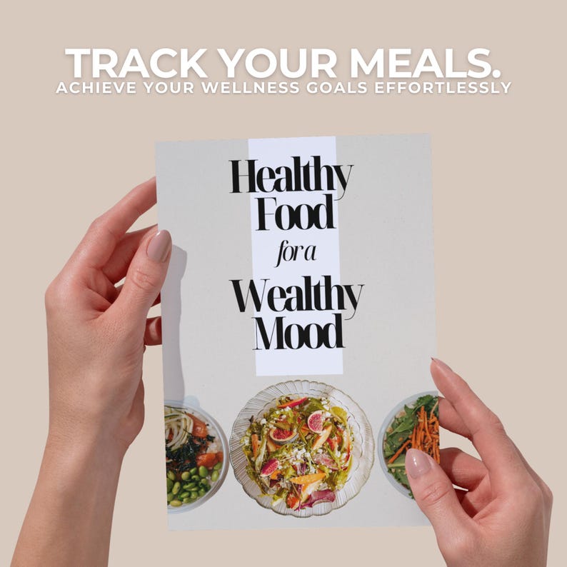 May include: A white booklet with the title "Healthy Food for a Wealthy Mood" and images of three different bowls of food. The booklet is being held by two hands.