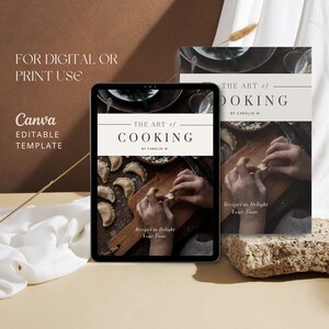 May include: A digital mockup of a cookbook cover with the title "The Art of Cooking" by Carolin W. The cover features a photo of hands making dumplings on a wooden cutting board. The text "Recipes to Delight Your Taste" is also on the cover.