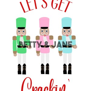 May include: Three nutcracker figurines in green, pink, and blue with the text "Let's Get Crackin'" in red.