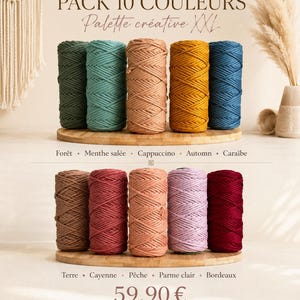 May include: A set of ten spools of macrame cord arranged on two wooden circular boards. The colors include forest green, mint, cappuccino, autumn yellow, Caribbean blue, earth brown, cayenne red, peach, light lilac, and deep burgundy red.