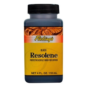 May include: A black bottle of Fiebing's Resolene protective acrylic finish for leather. The bottle is labelled "Black Resolene Protective Acrylic Finish for Leather" and "Net 4 fl. oz. 118 ml".