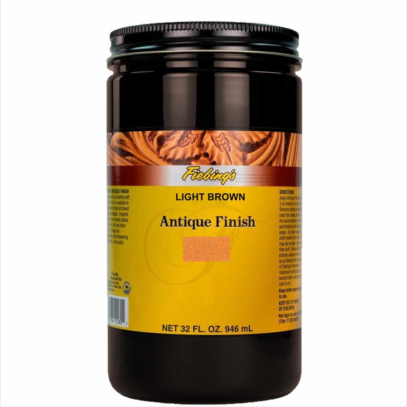May include: A brown glass jar with a black lid labeled "Fiebing's Light Brown Antique Finish" and a net volume of 32 fluid ounces or 946 milliliters.