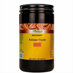 May include: A 32-ounce bottle of Fiebing's Mahogany Antique Finish leather dye. The bottle is black with a yellow label that says "Fiebing's Mahogany Antique Finish".