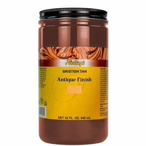 May include: A glass jar with a black lid containing Fiebing's British Tan Antique Finish leather dye. The jar is labeled with the product name and size: 32 fl. oz. (946 ml).