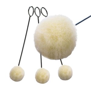 May include: Set of four white paint daubers with metal handles. The daubers are attached to the handles with a metal loop.