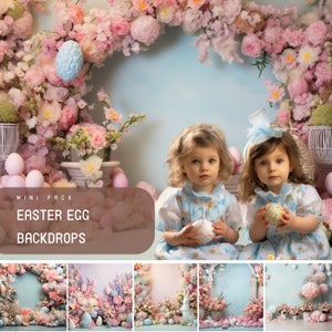 May include: Two young girls in floral dresses pose in front of a backdrop decorated with pink flowers, pastel Easter eggs, and a blue sky. The backdrop is labelled "MINI PACK EASTER EGG BACKDROPS".
