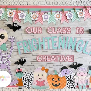 May include: A Halloween classroom display board with the words "OUR CLASS IS FRIGHTENINGLY CREATIVE!". The board features a skeleton, bats, ghosts, a pumpkin, and other spooky characters. The color scheme includes pink, teal, and black.