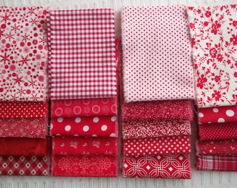 May include: A collection of red and white fabric squares with various patterns, including snowflakes, gingham, polka dots, and floral designs. The fabrics are stacked in neat rows, showcasing a variety of textures and prints suitable for quilting or crafting projects.