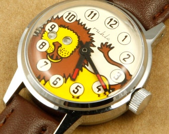 Ruhla Lion Moving Eyes Montre mécanique pour enfants à remontage manuel 29 mm Fabriqué en Allemagne de l'Est New Old Stock