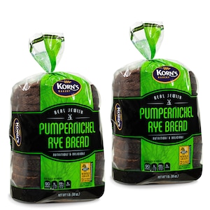 May include: Two packages of Korn's Bakery Real Jewish Pumpernickel Rye Bread. Each package contains a loaf of dark brown bread with a green and black label. The label reads "Korn's Bakery Real Jewish Pumpernickel Rye Bread, Nutritious & Delicious, 100% Whole Grain".