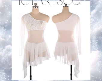 May include: White one-shoulder figure skating dress with a sheer overlay and a beaded bodice. The dress has a short, asymmetrical skirt with a long, flowing train.