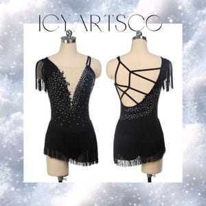 May include: Black dance leotard with a fringe skirt and a criss-cross back design. The leotard is decorated with rhinestones.