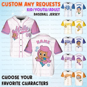 May include: Custom baseball jerseys for kids, youth, and adults. The image shows several white jerseys with colorful accents and character designs. The text on the jerseys includes names and numbers. The jerseys are customizable with any requests.