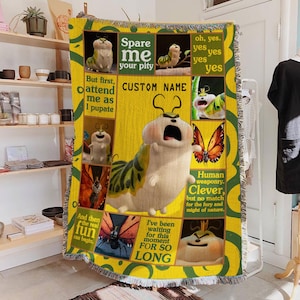 May include: A handmade wooden sign with the text "Welcome to our home" in a handwritten style. The sign is painted white with a dark stained wooden frame. A small green plant is placed on the sign.