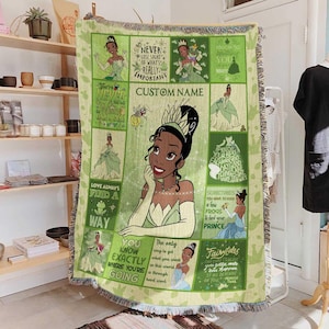 May include: A green woven throw blanket featuring a princess design with inspirational quotes and the text "CUSTOM NAME". The blanket has a fringe border and is decorated with images of a princess in a green dress.