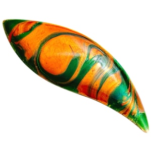 May include: An elongated, leaf-shaped object with a vibrant, swirled design. The piece features a blend of orange, green, and gold hues, creating a marbled effect. The object has a glossy finish and a pointed tip, suggesting a decorative or artistic purpose.