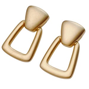 May include: A pair of gold-colored earrings. Each earring features a geometric design with a triangular top and a rectangular open frame. The earrings have a matte finish and a simple, elegant style.
