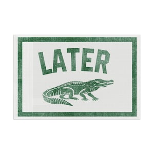 May include: A rectangular, white sign with a green border and text. The word "LATER" is printed in large, green, uppercase letters above a green alligator illustration. The design has a distressed, vintage look.