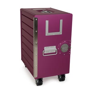 May include: A magenta rolling storage container with a rectangular shape. It features a handle on top, a silver metal frame, and a circular metal detail on the side. The container has four black wheels and a handle on the front.