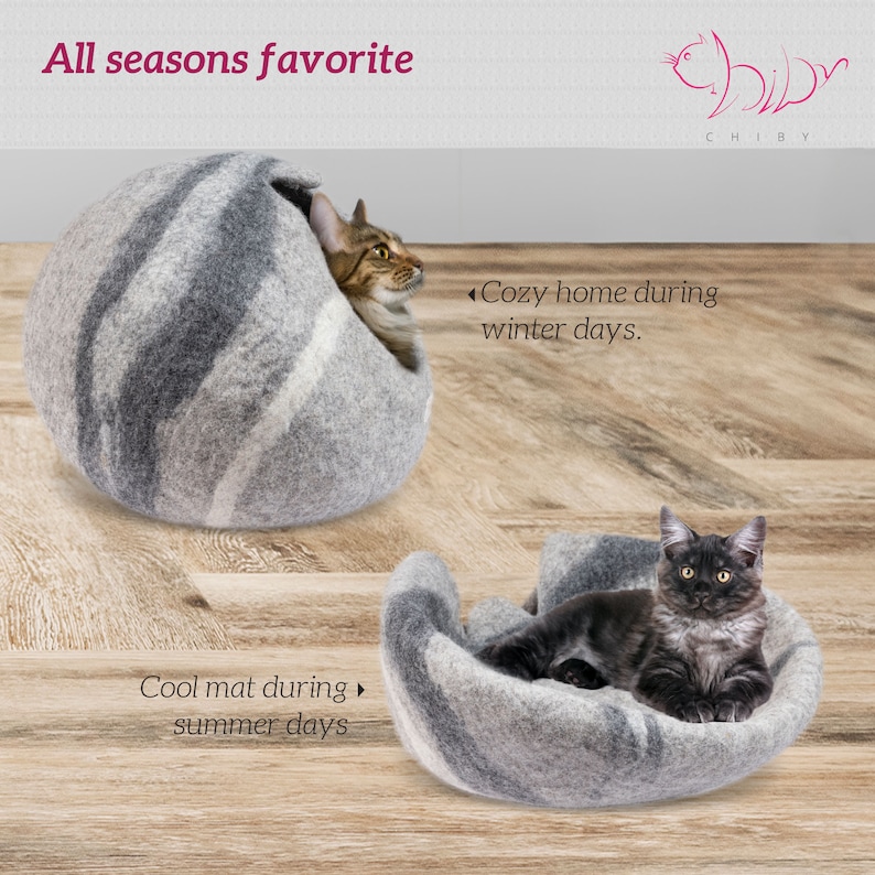 May include: A gray and white felt cat bed with a cat curled up inside. The bed is shaped like a bowl and has a raised edge. The text "Cozy home during winter days." is written on the right side of the image. The text "Cool mat during summer days." is written on the left side of the image.